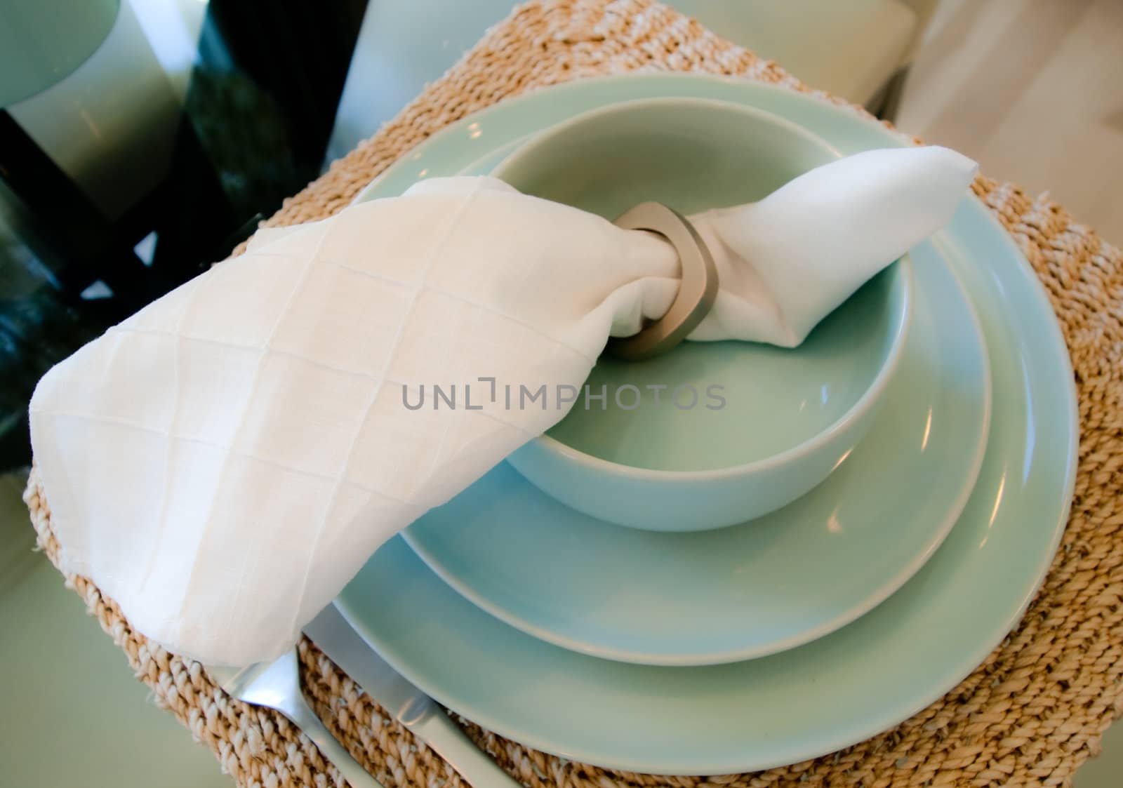 Elegant green table setting with white napkin
