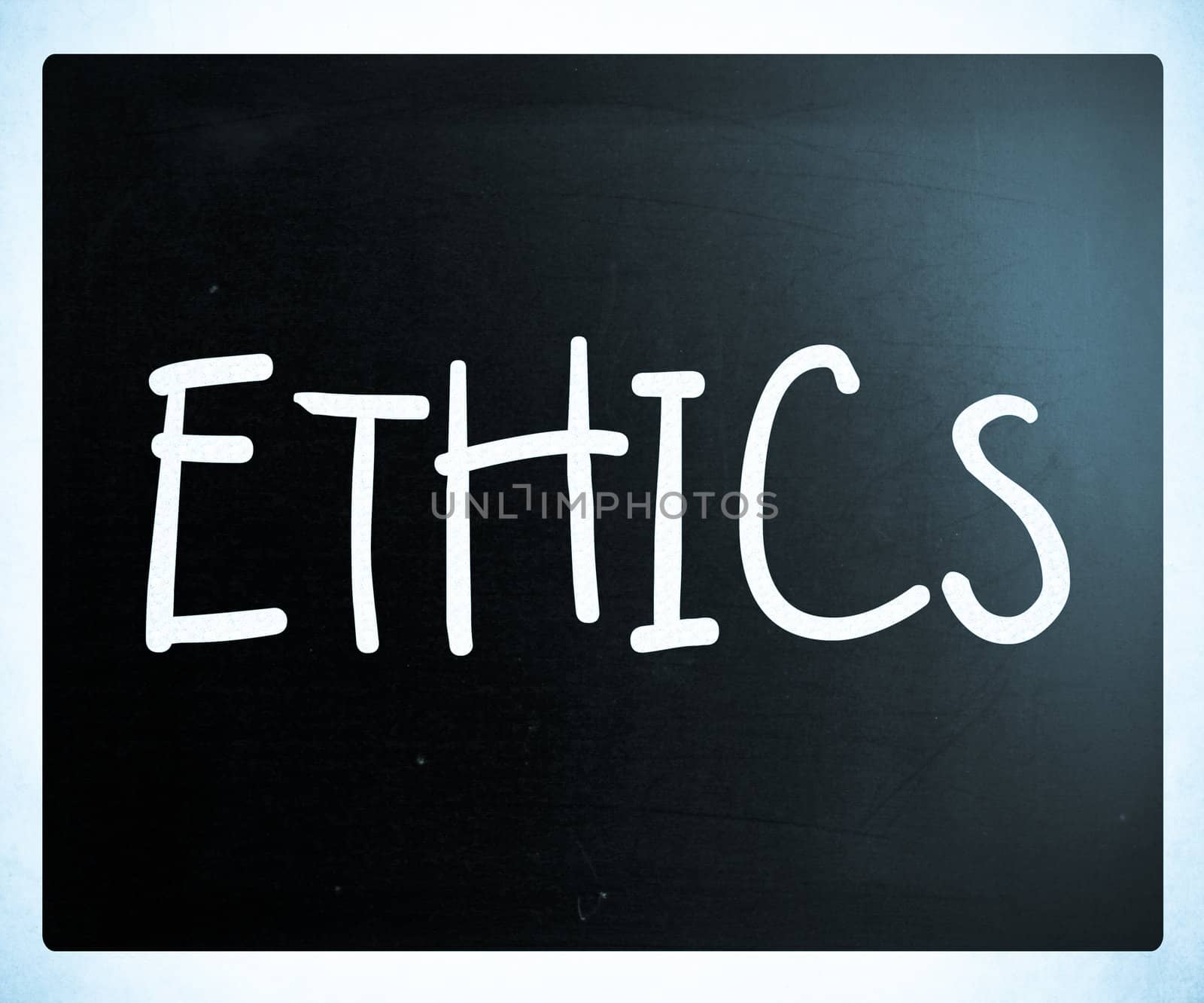 "Ethics" handwritten with white chalk on a blackboard