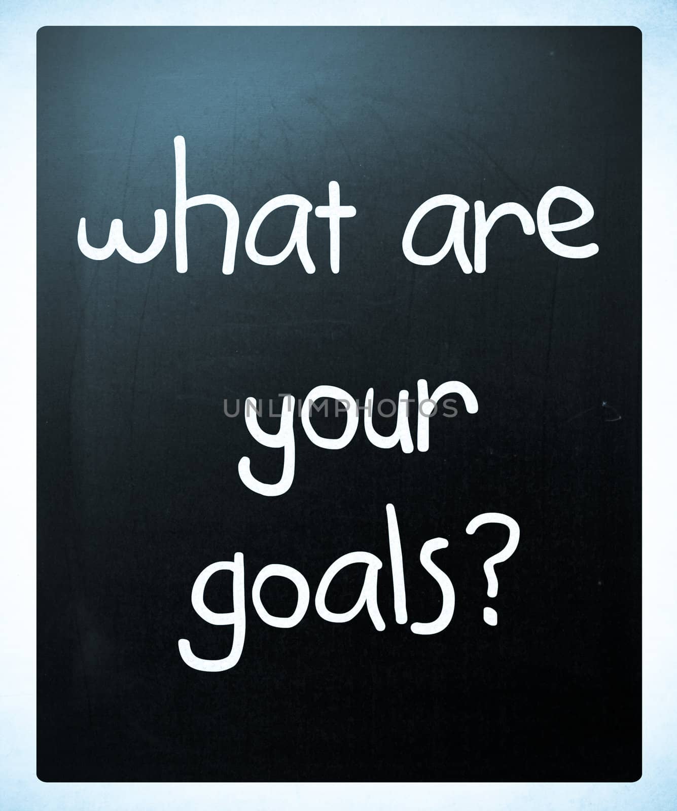 "What are your goals?" handwritten with white chalk on a blackboard