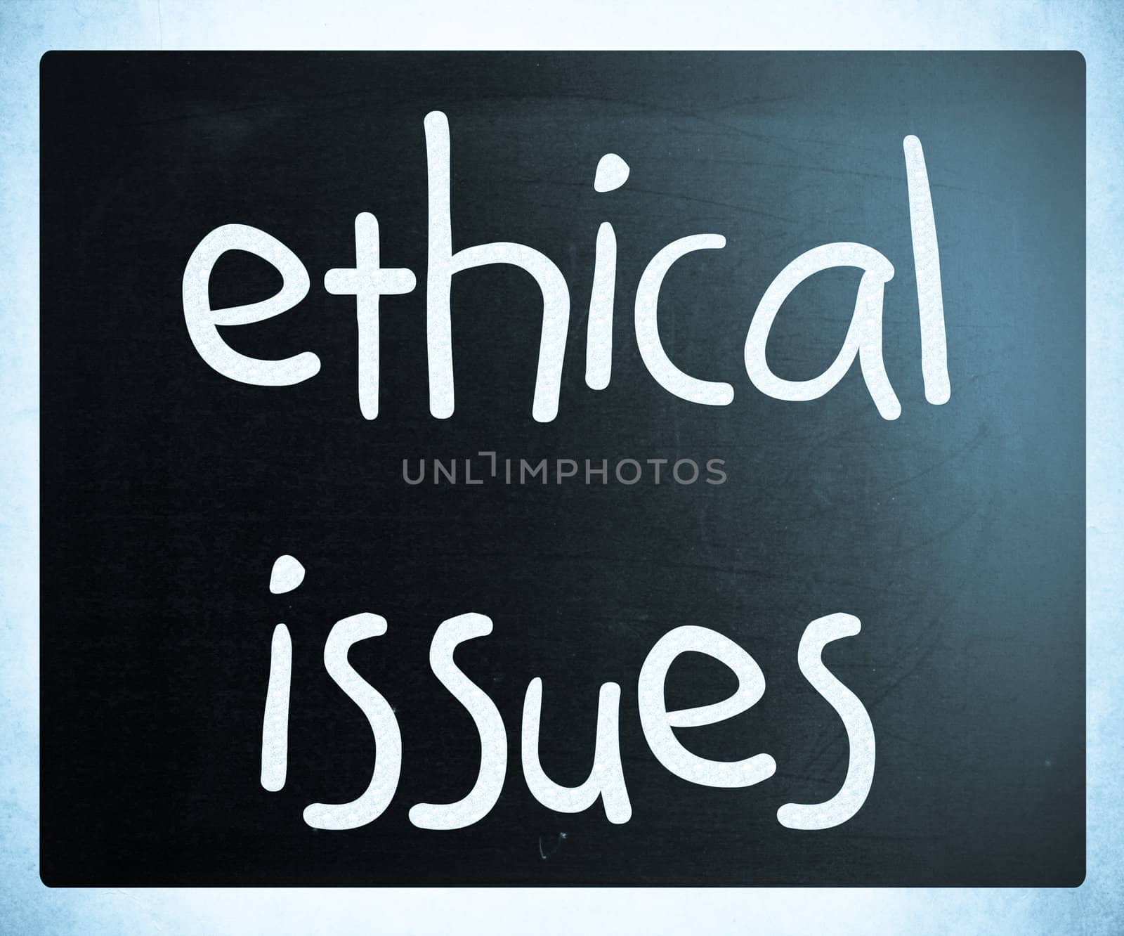 "Ethical issues" handwritten with white chalk on a blackboard