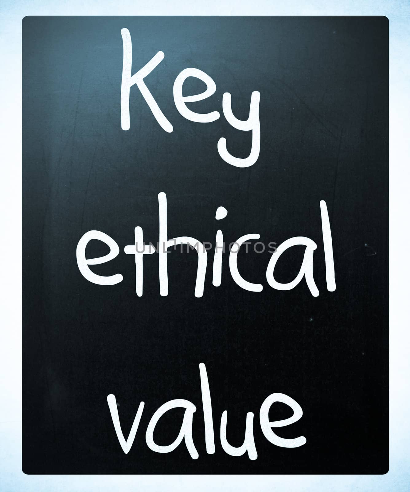 "key ethical value" handwritten with white chalk on a blackboard