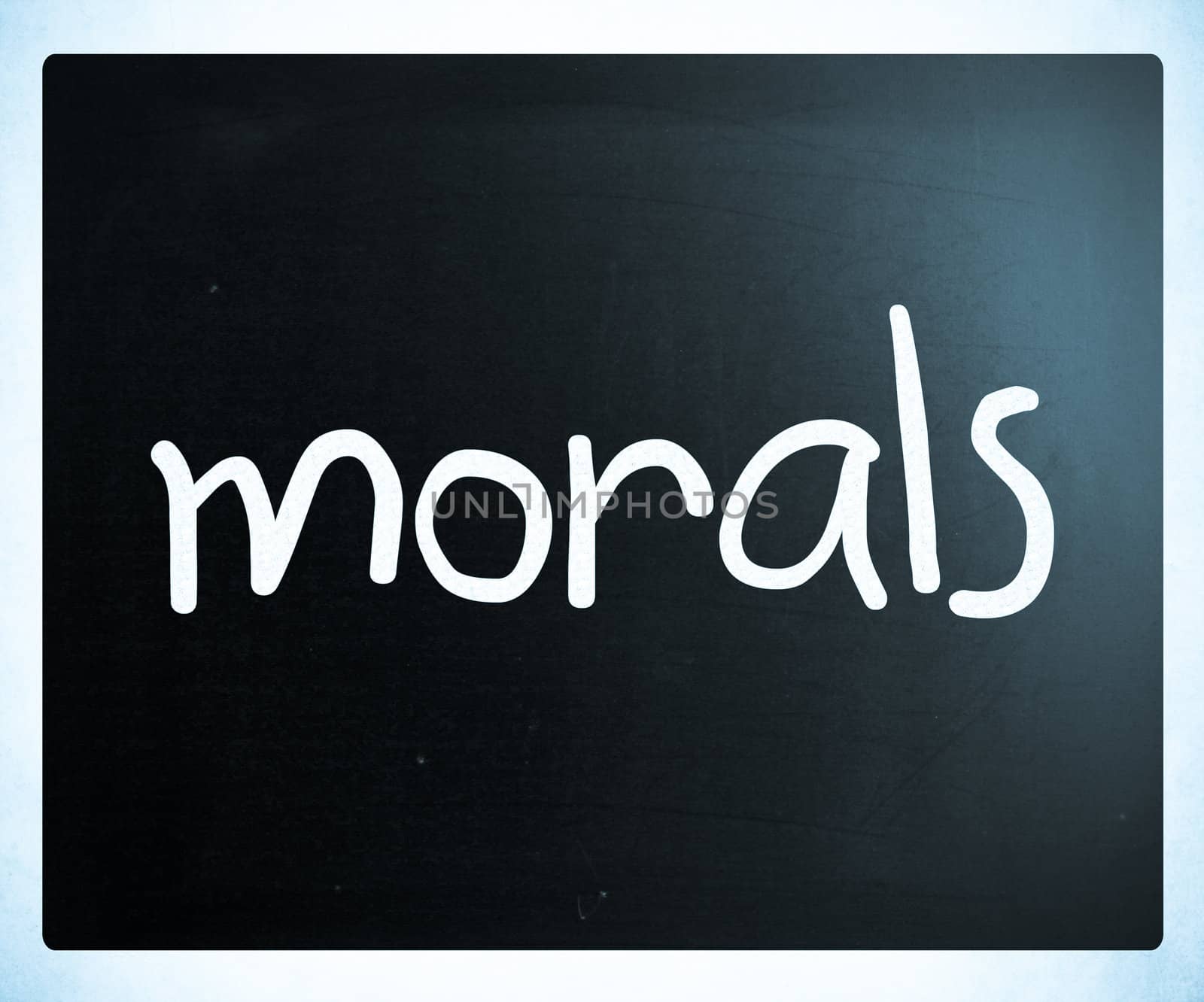 "Morals" handwritten with white chalk on a blackboard