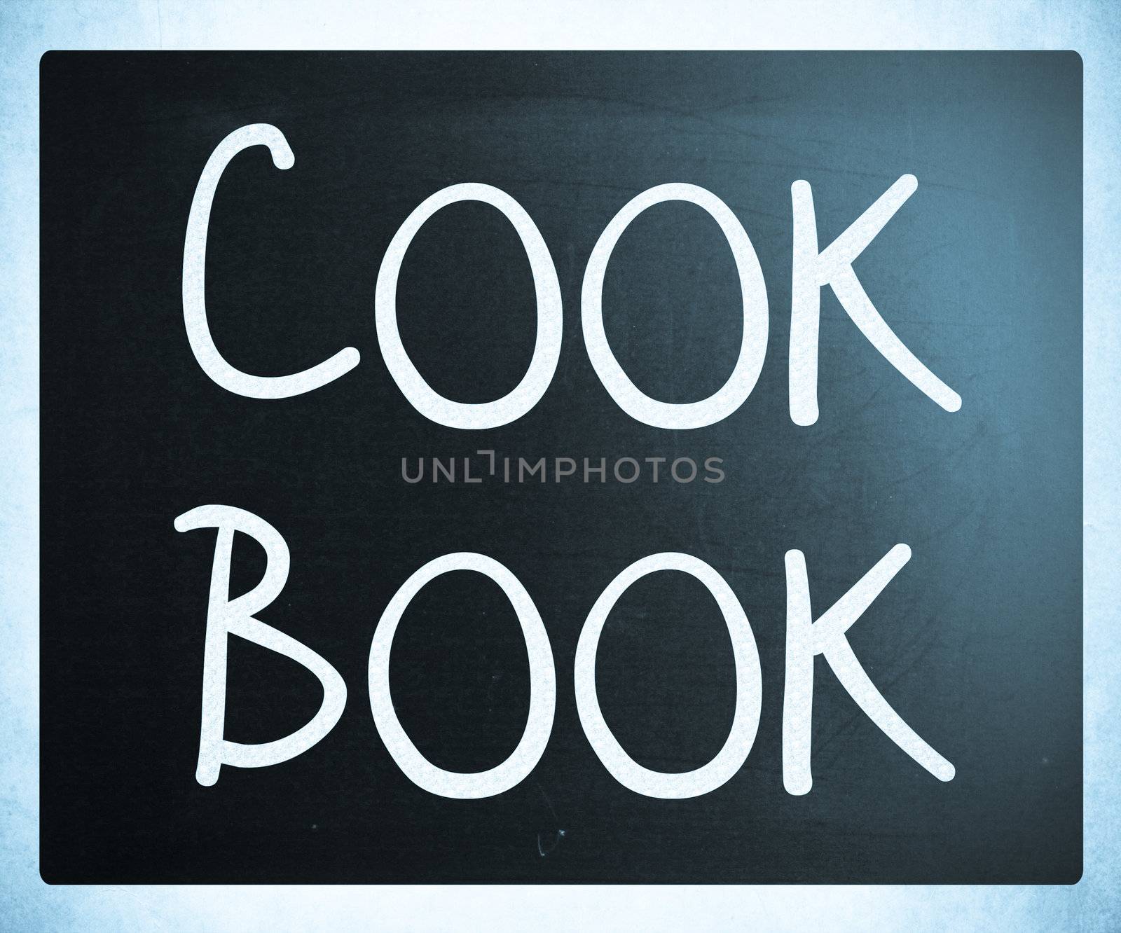 "Cook book" handwritten with white chalk on a blackboard