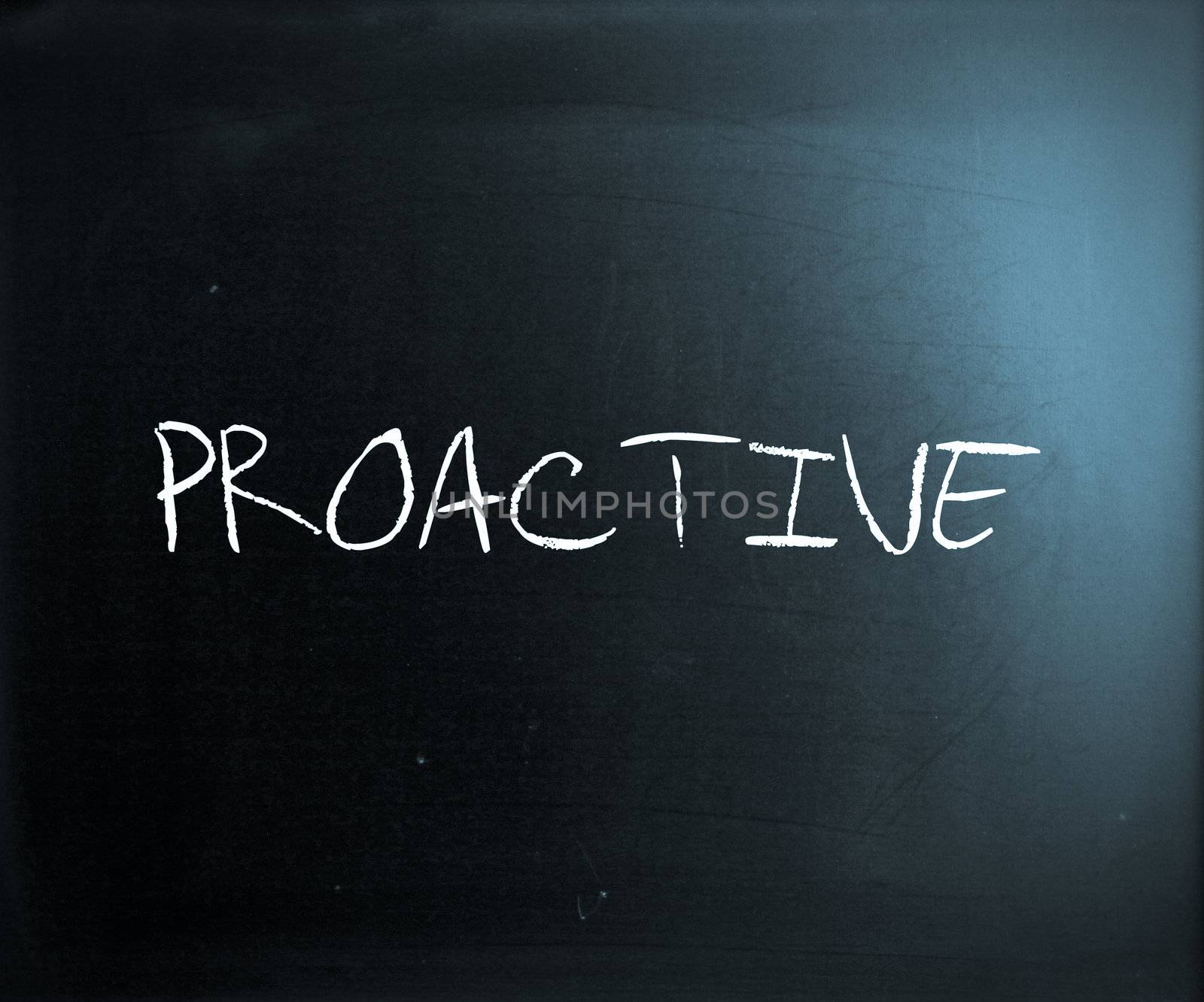 The word 'Proactive' handwritten with white chalk on a blackboard.
