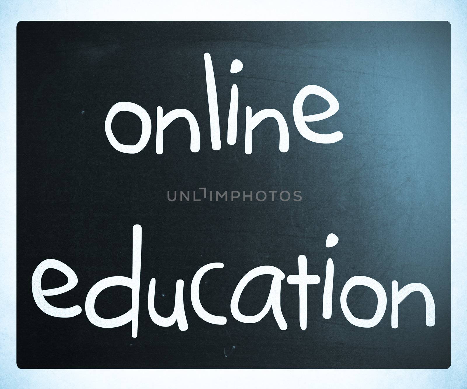 "Online education" handwritten with white chalk on a blackboard