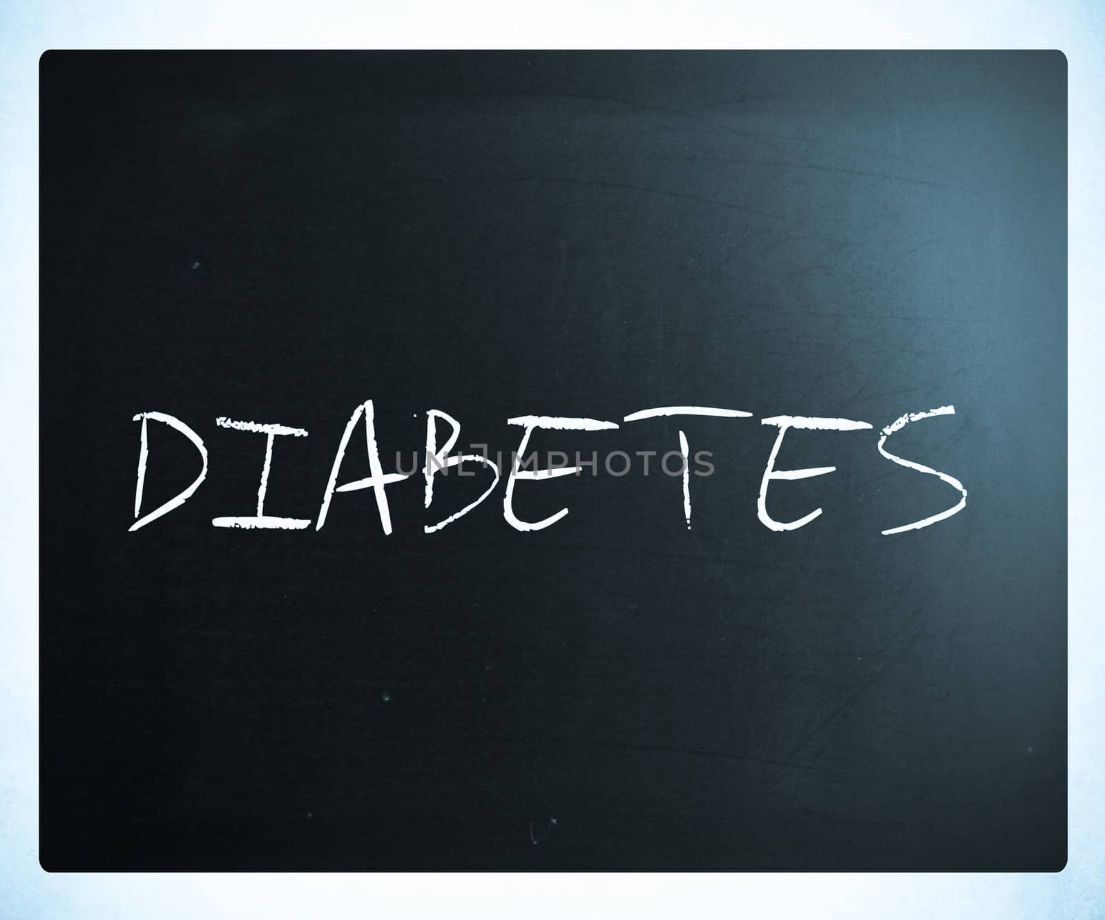 The word "Diabetes" handwritten with white chalk on a blackboard.