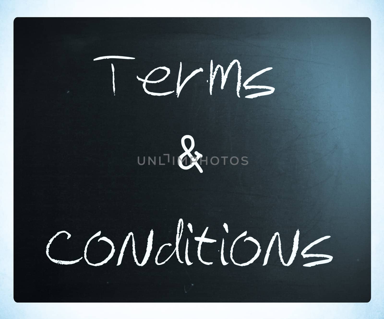 "Terms & Conditions" handwritten with white chalk on a blackboard.