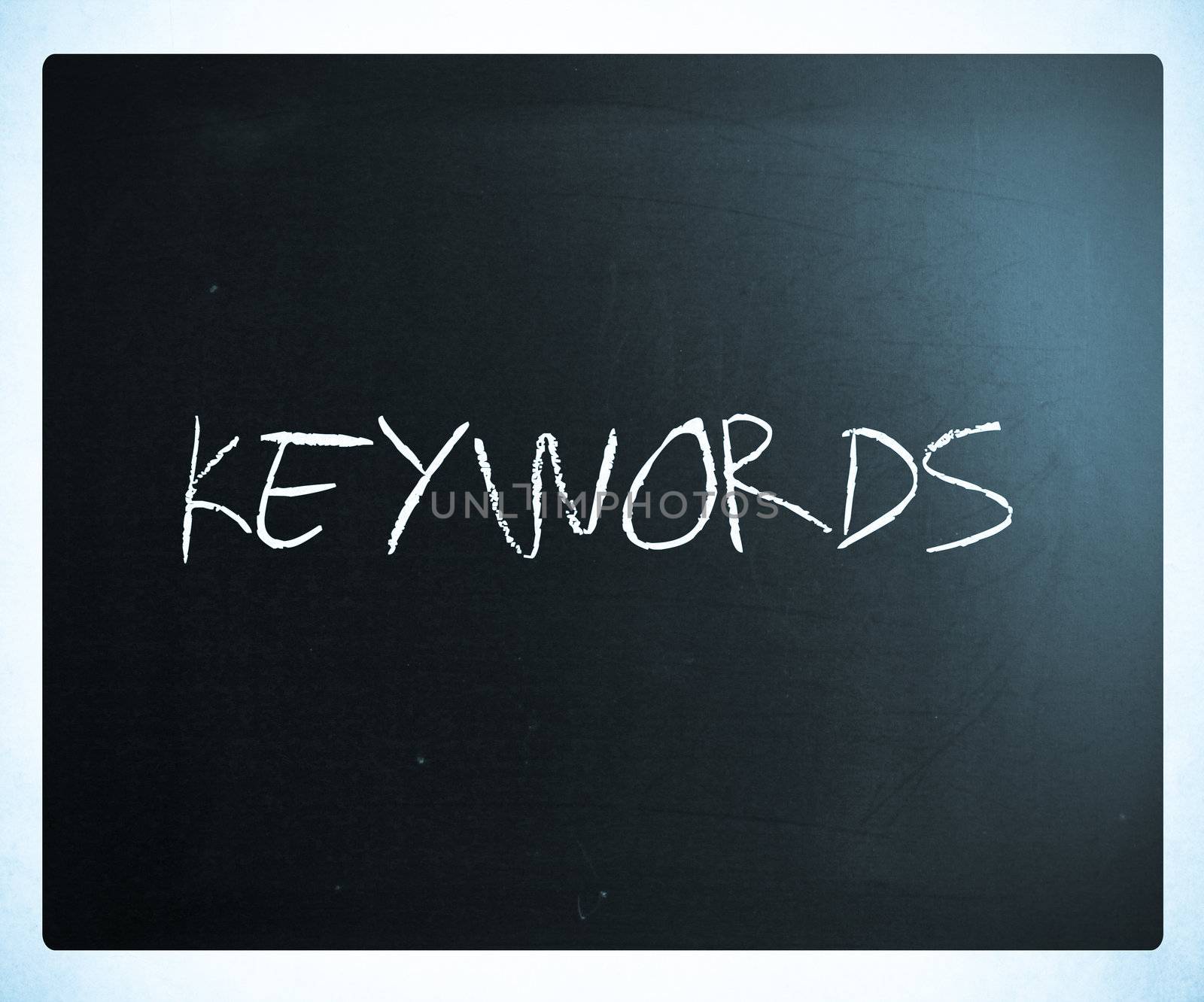 The word "Keywords" handwritten with white chalk on a blackboard.