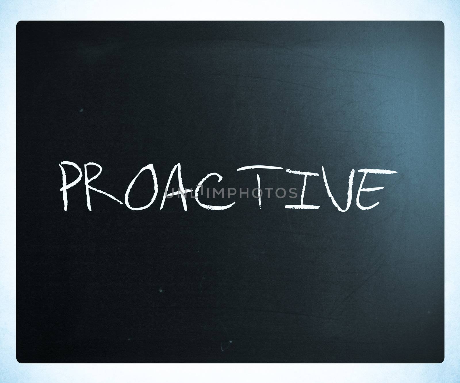 The word 'Proactive' handwritten with white chalk on a blackboard.