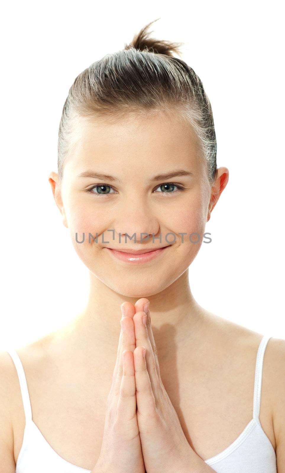 Closeup of pretty girl with hands held together by stockyimages