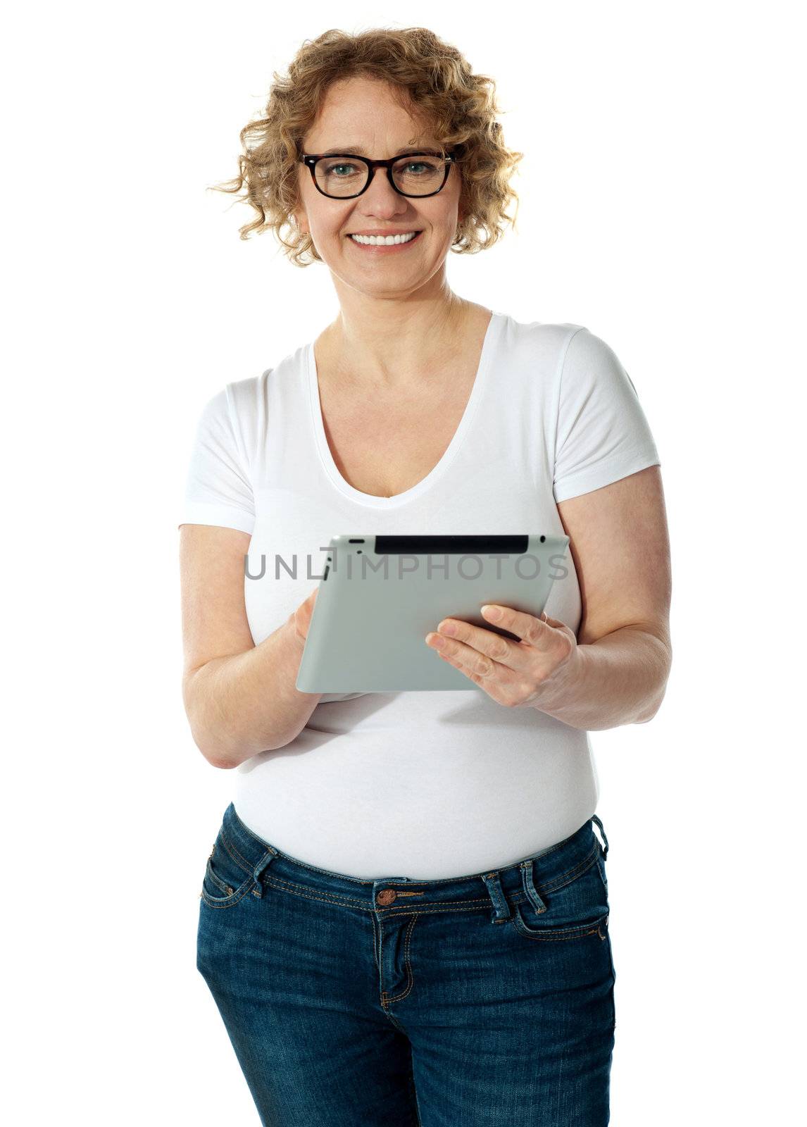 Senior woman holding tablet, smiling. Isolated on white background