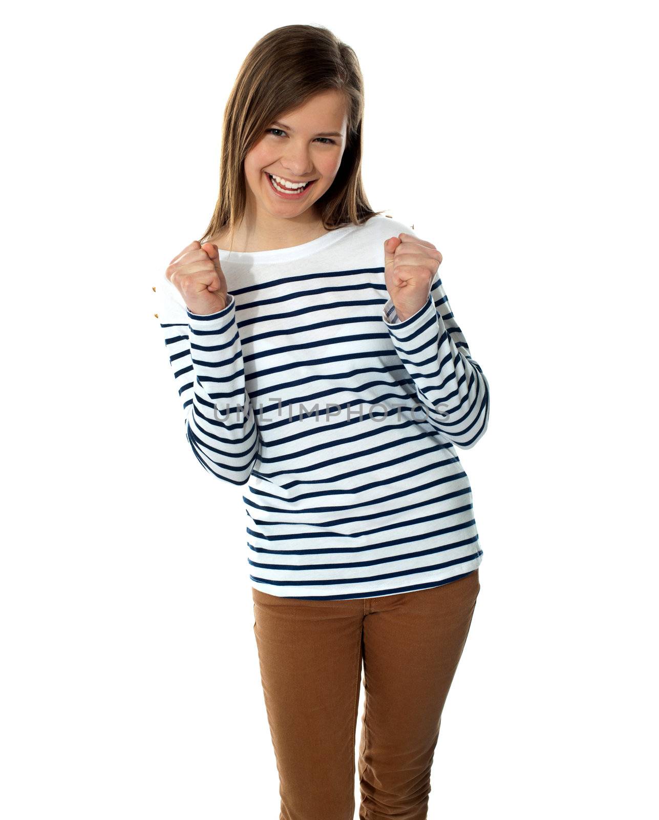 Excited sweet smiling teenager by stockyimages