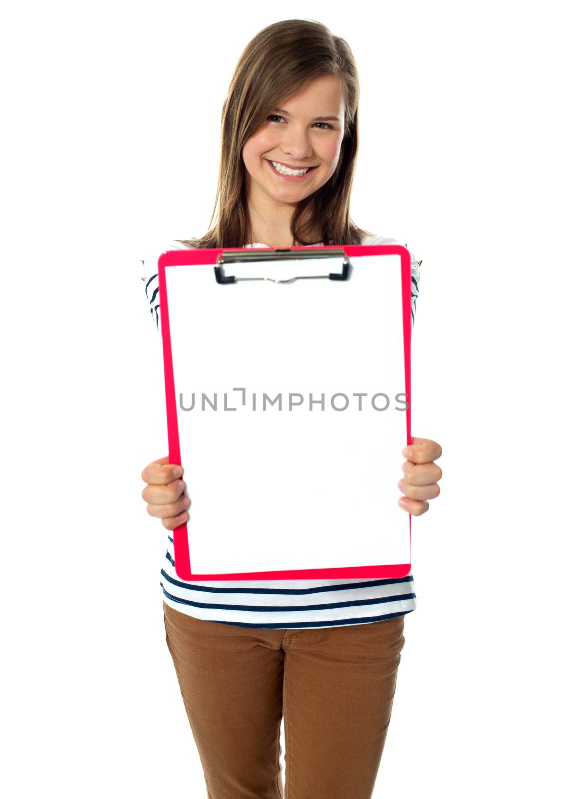 Teenager showing blank paper on clipboard to camera