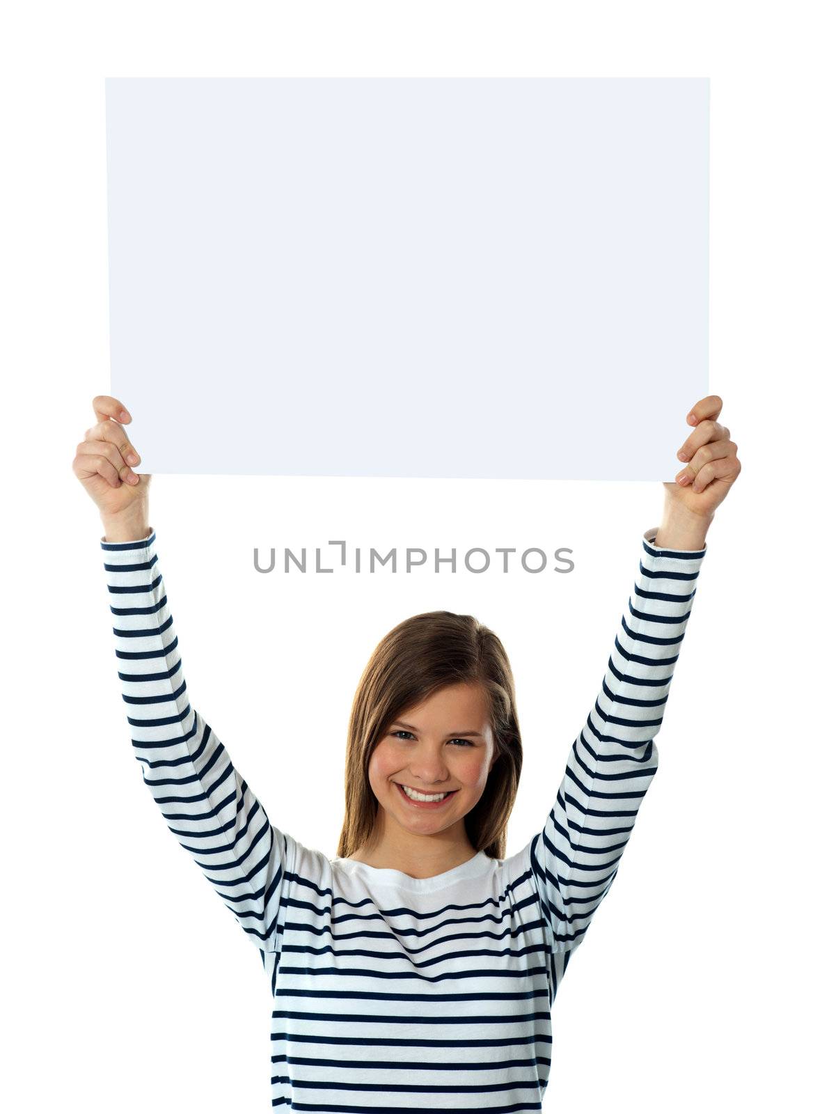 Cute girl lifting blank placard high, isolated agianst white background