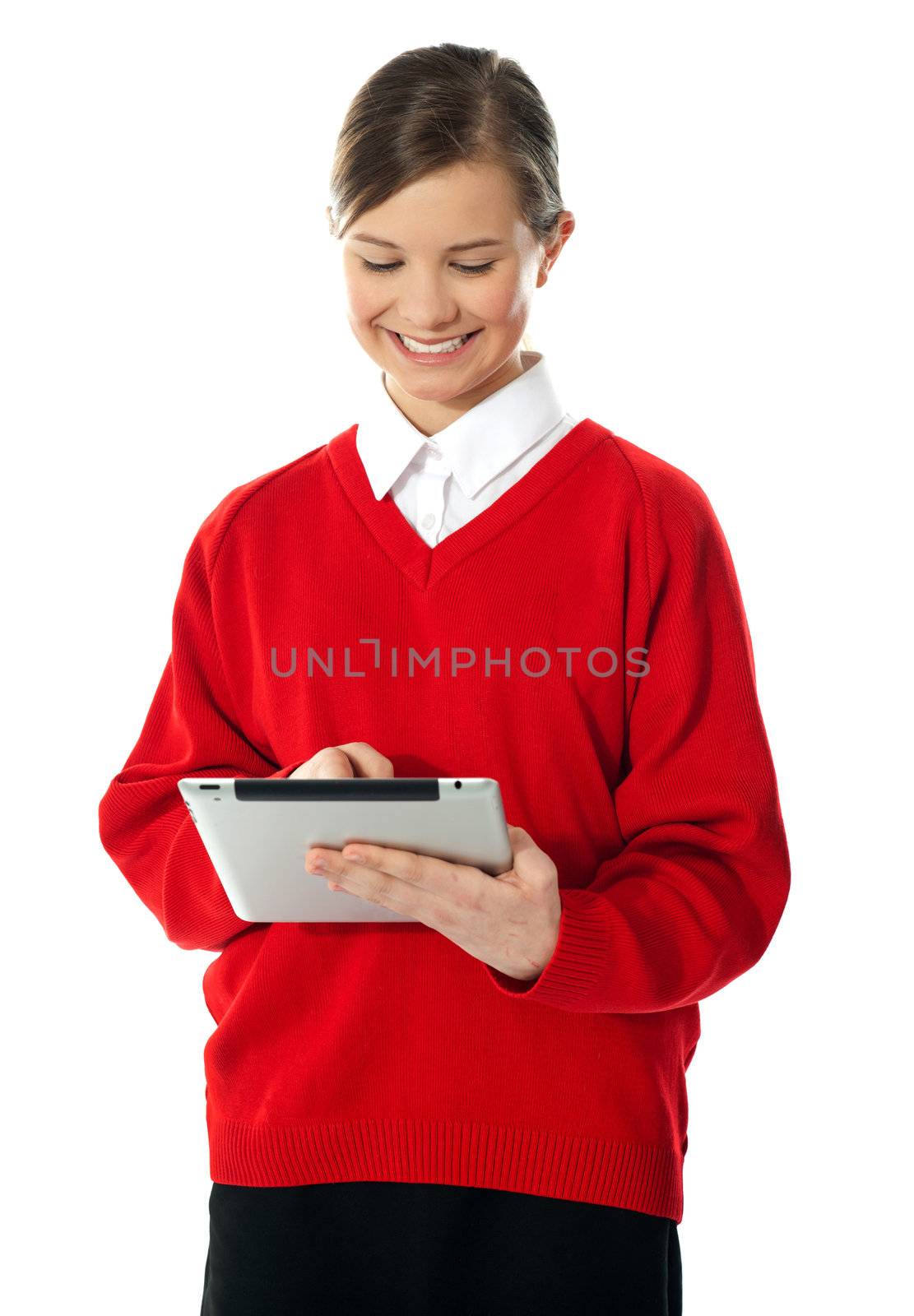 School girl using new touch pad device. Isolated on white