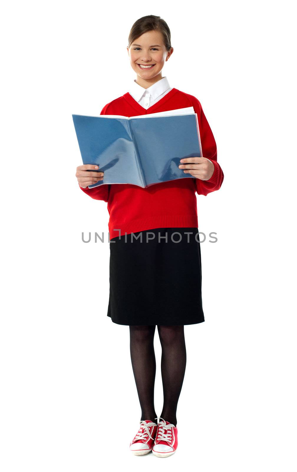 Caucasian smiling student girl standing with exercise book