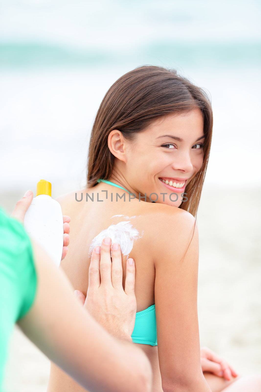 Sunscreen on beach vacation by Maridav