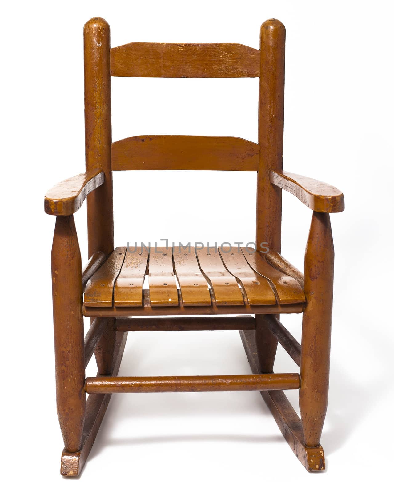 A worn child's rocking chair isolated on white