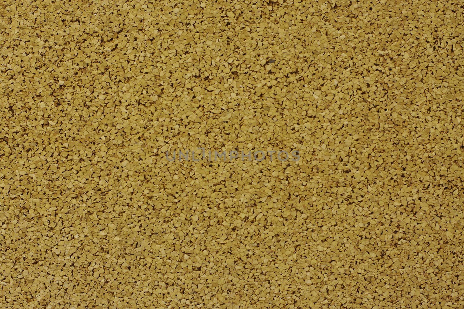 A horizontal close up of cork board showing texture detail, background 