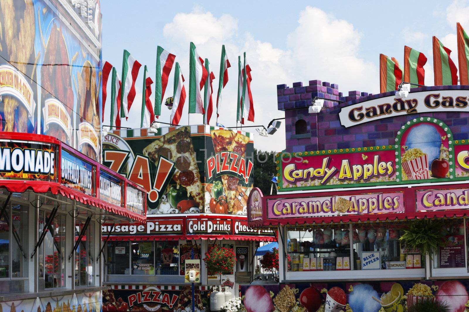 Colorful fair food booths at a local summer festival