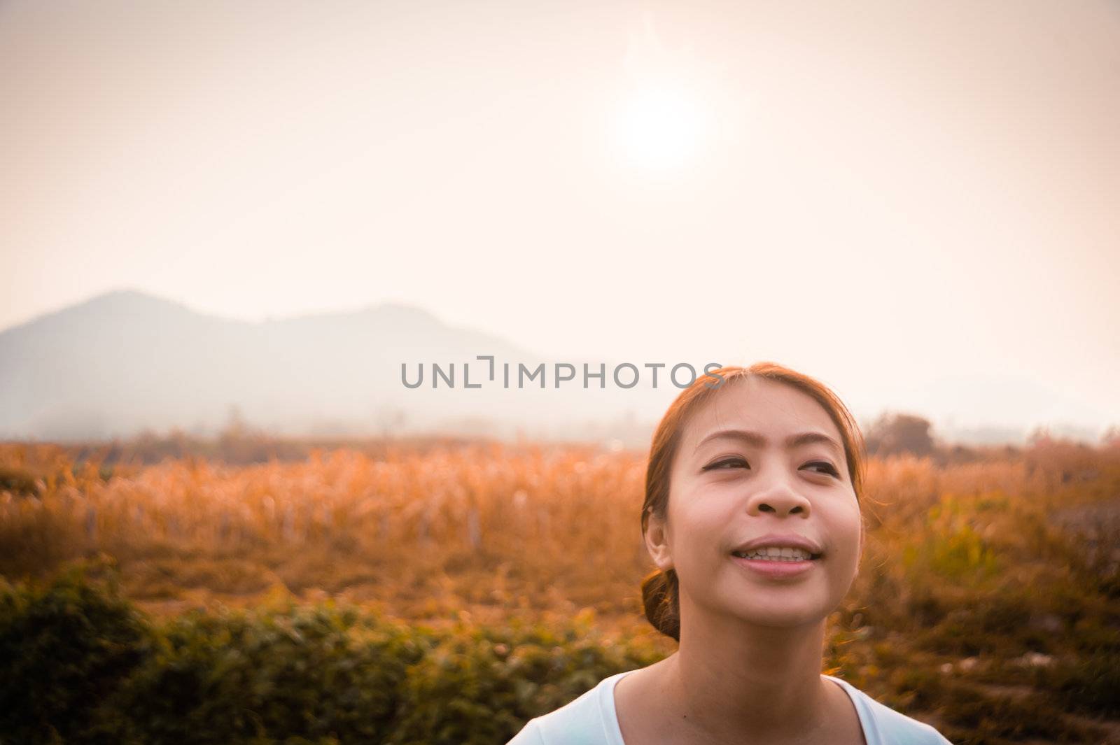 woman in field with sunlight by moggara12