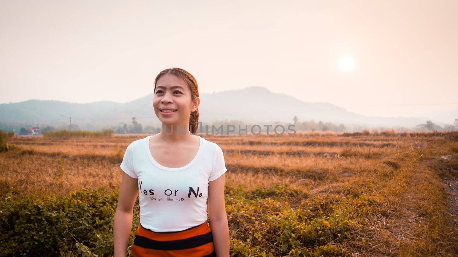 woman in field with sunlight by moggara12