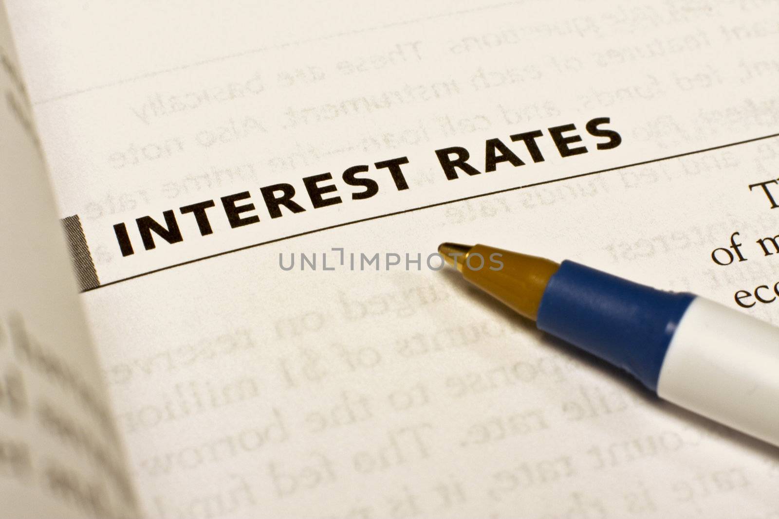 A pen points to the words interest rates