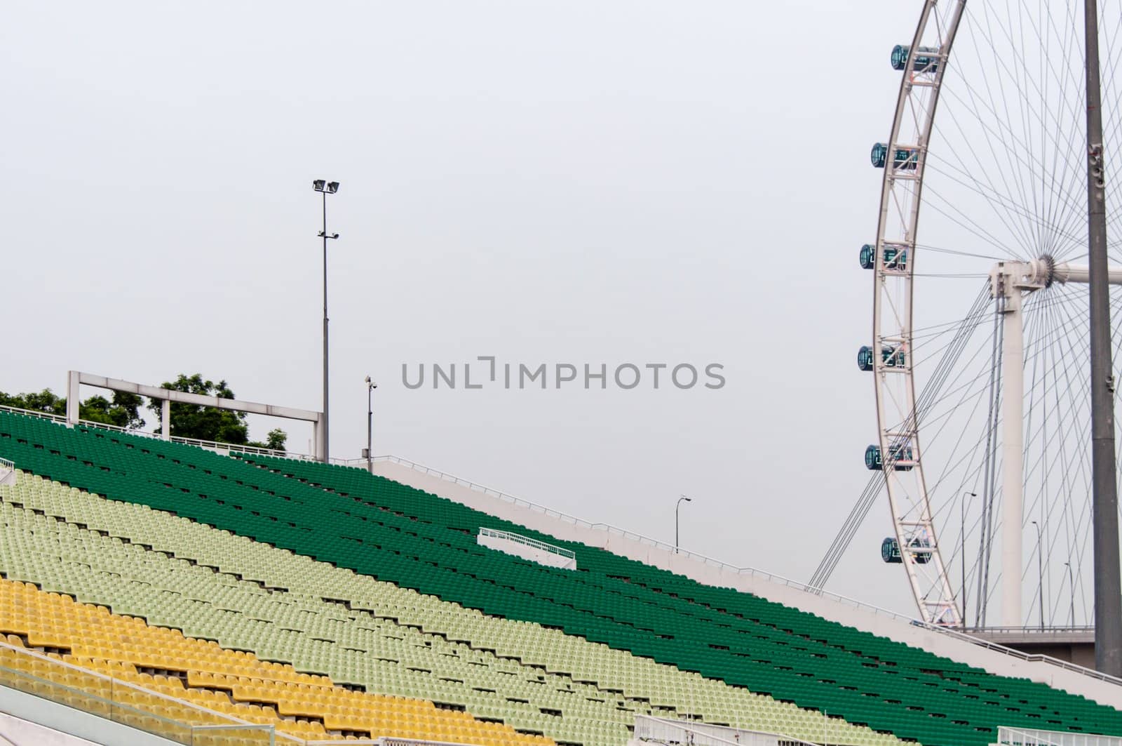 A view of Singapore flyer and colourful tribunes of the stadium at the marina