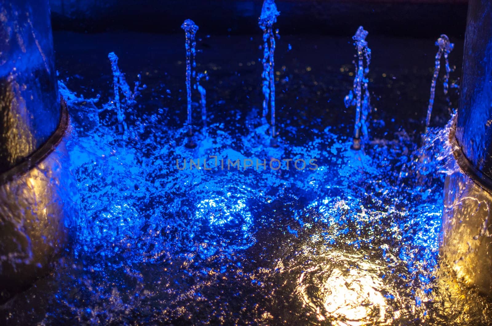 closeup of a beautiful fountain with colourful lighting