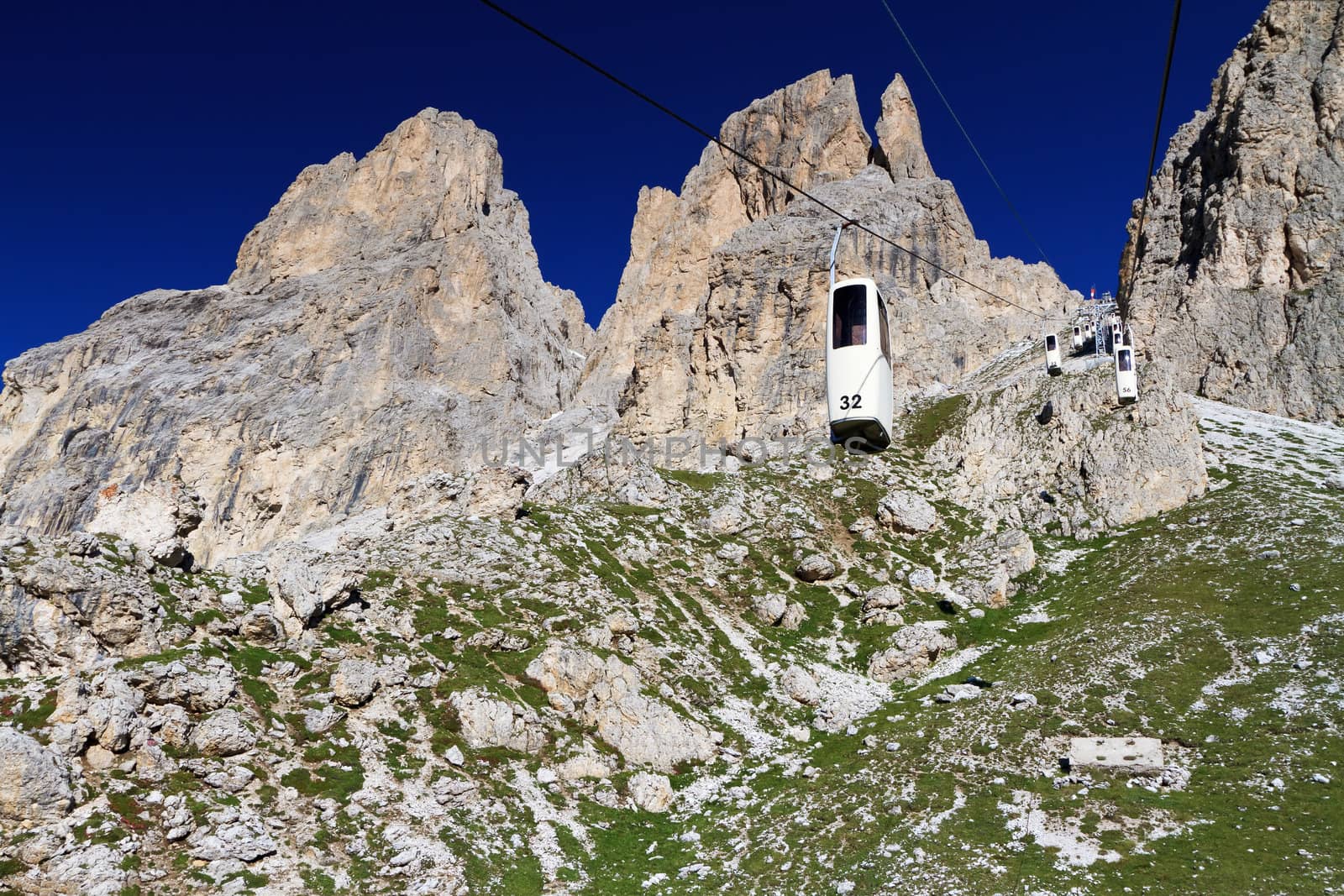 summer view of Sassolungo mountain with the characteristic cableway, Trentino, Italy