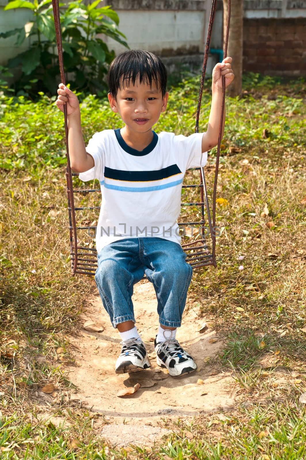 An handsome Asian kid of Thailand in Playground