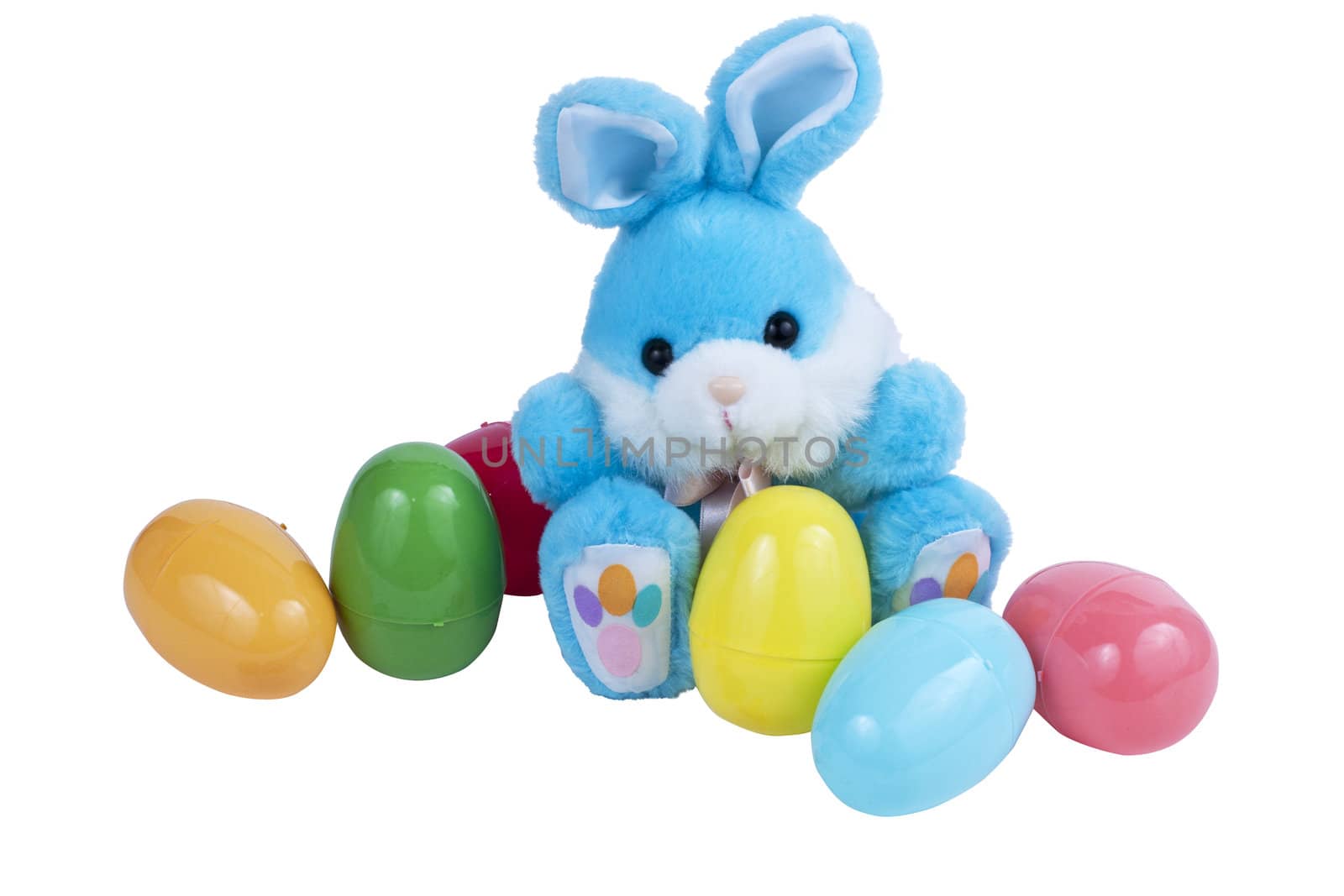 A blue Easter bunny with plastic Easter eggs isolated on white