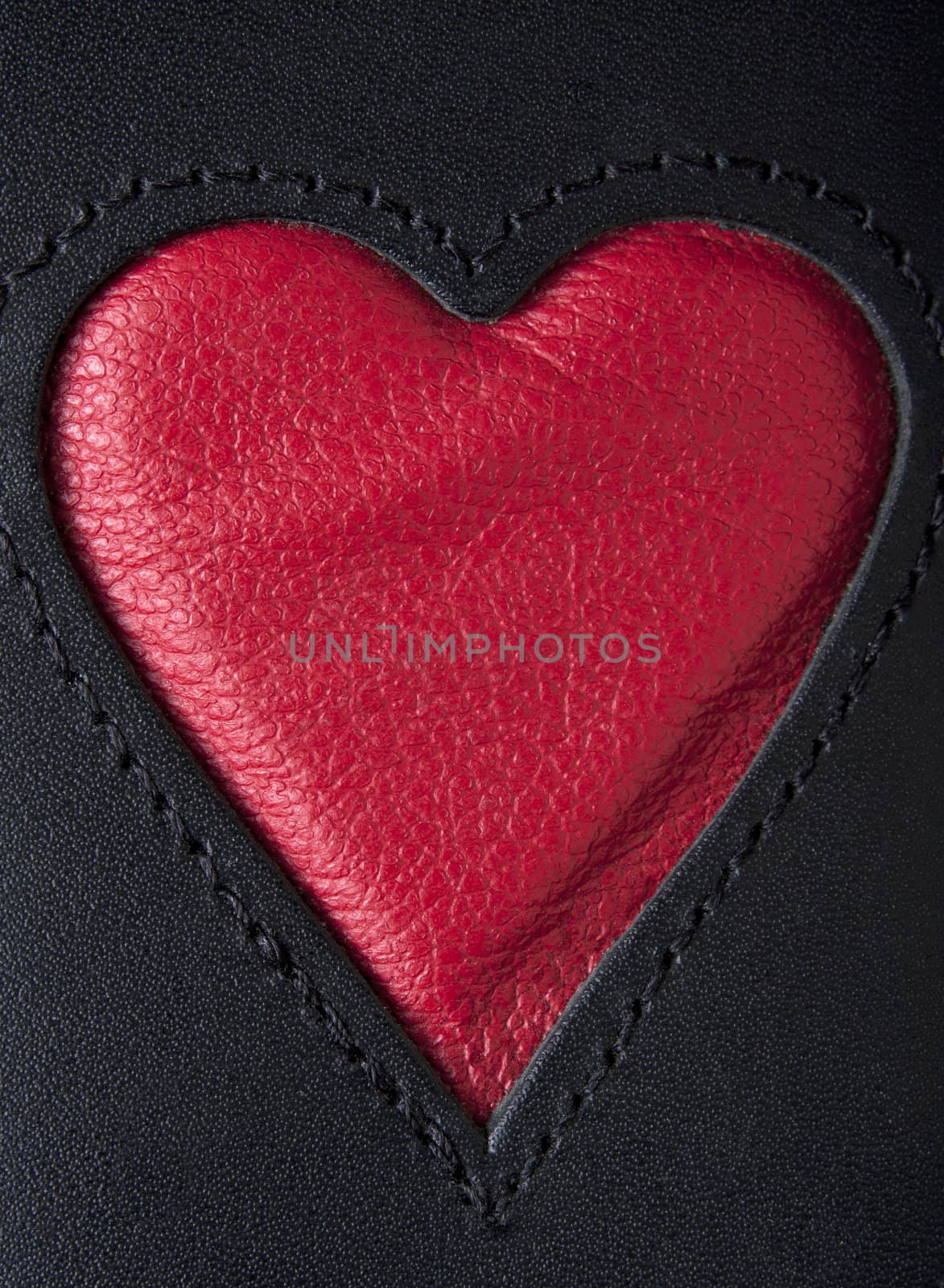 Leather heart symbol red on black stiched