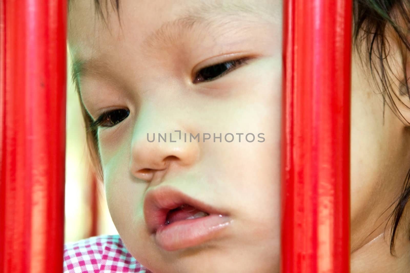 A Happy Asian Little baby girl flower on White Uniform of playground