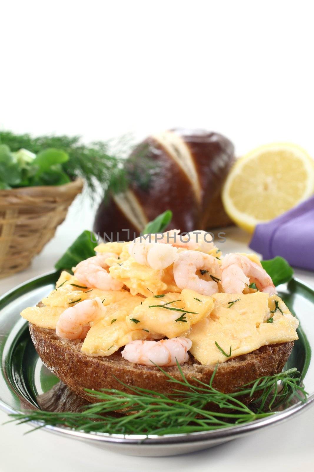fresh Scrambled eggs on toast with shrimp, dill and corn salad