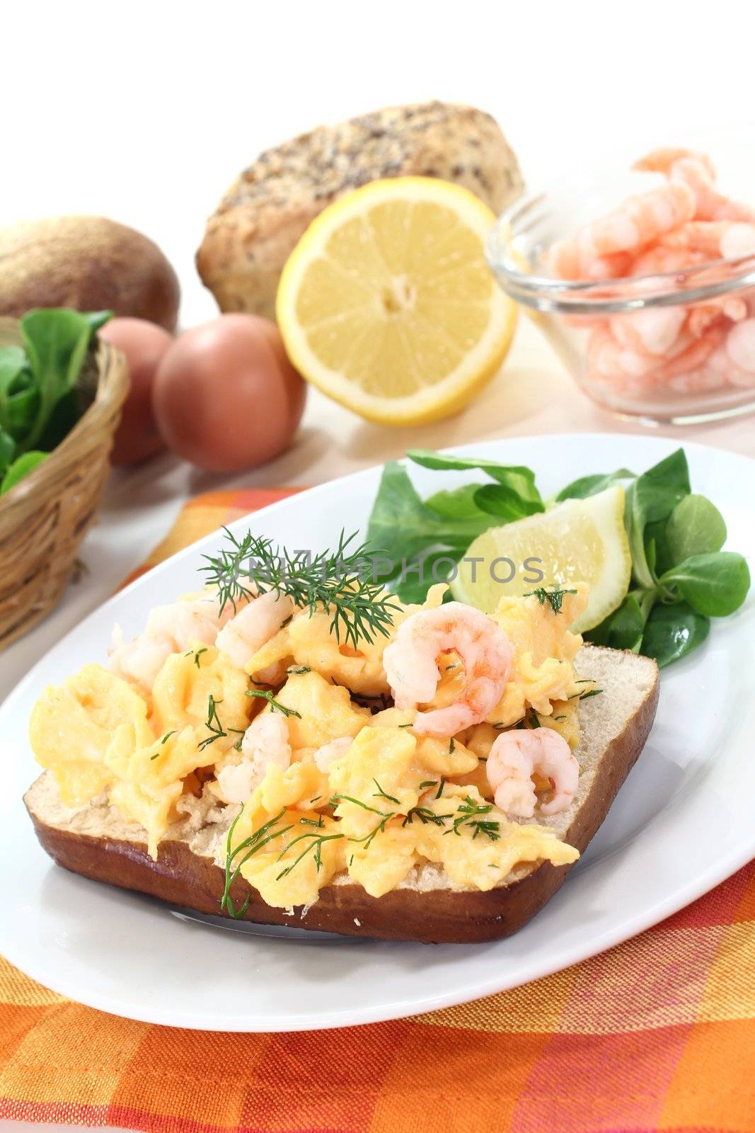 Scrambled eggs with fresh shrimp, dill and corn salad