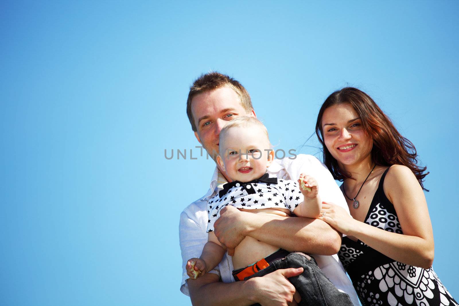 happy family on blue sky background