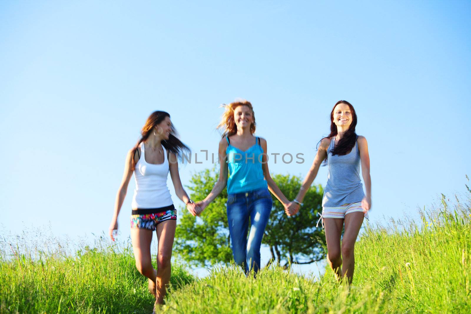 fun smile girlfriends run by green field sun is shine