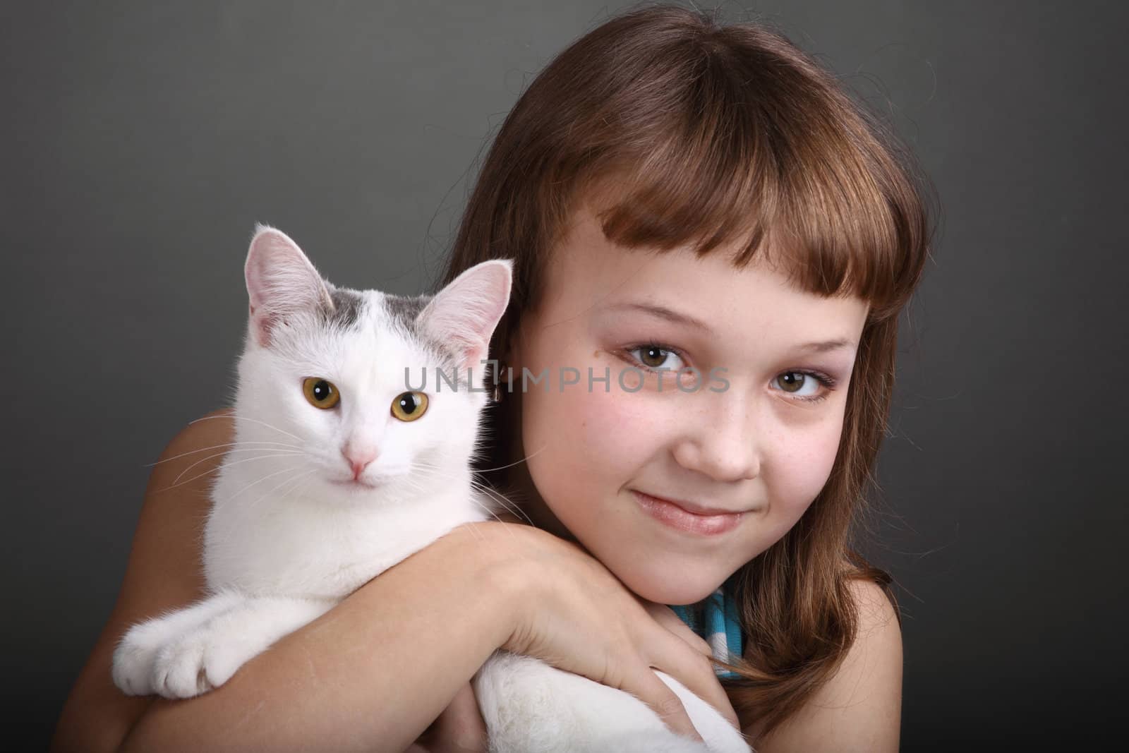 the girl and white cat play. close up. double 12