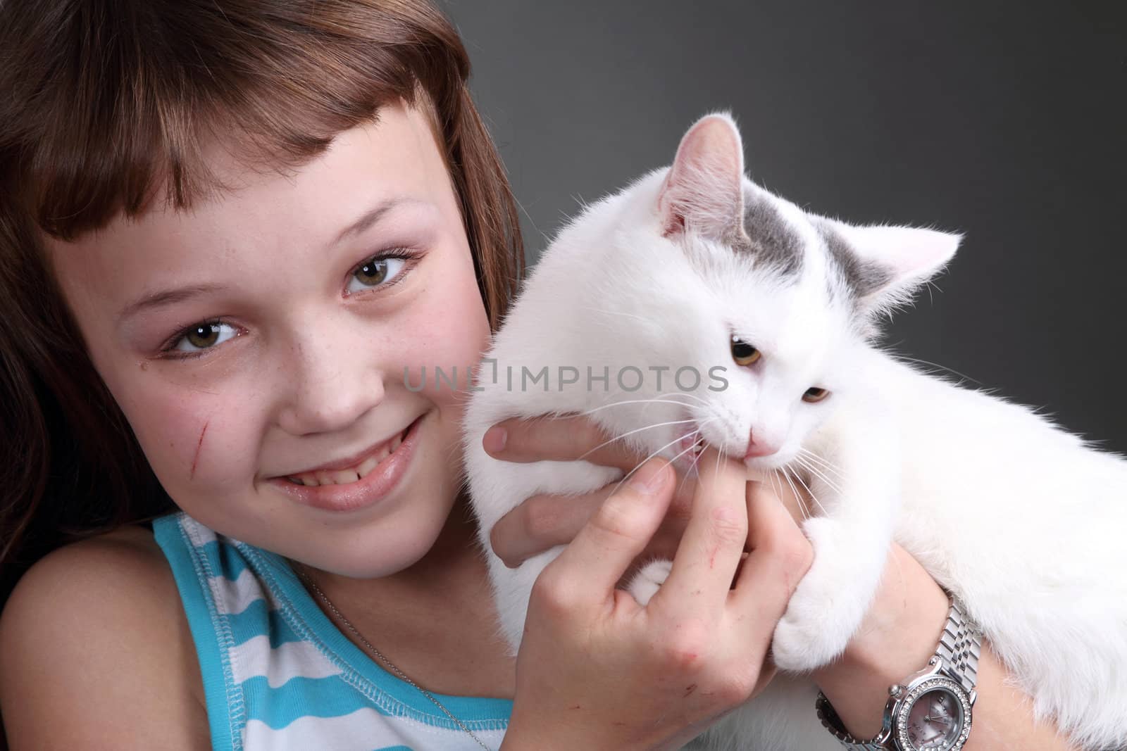 the girl and white cat play. close up. double 3