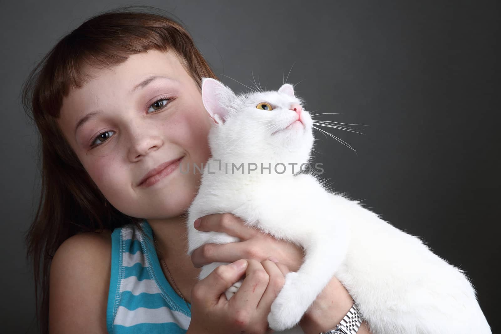 the girl and white cat play. close up. double 2