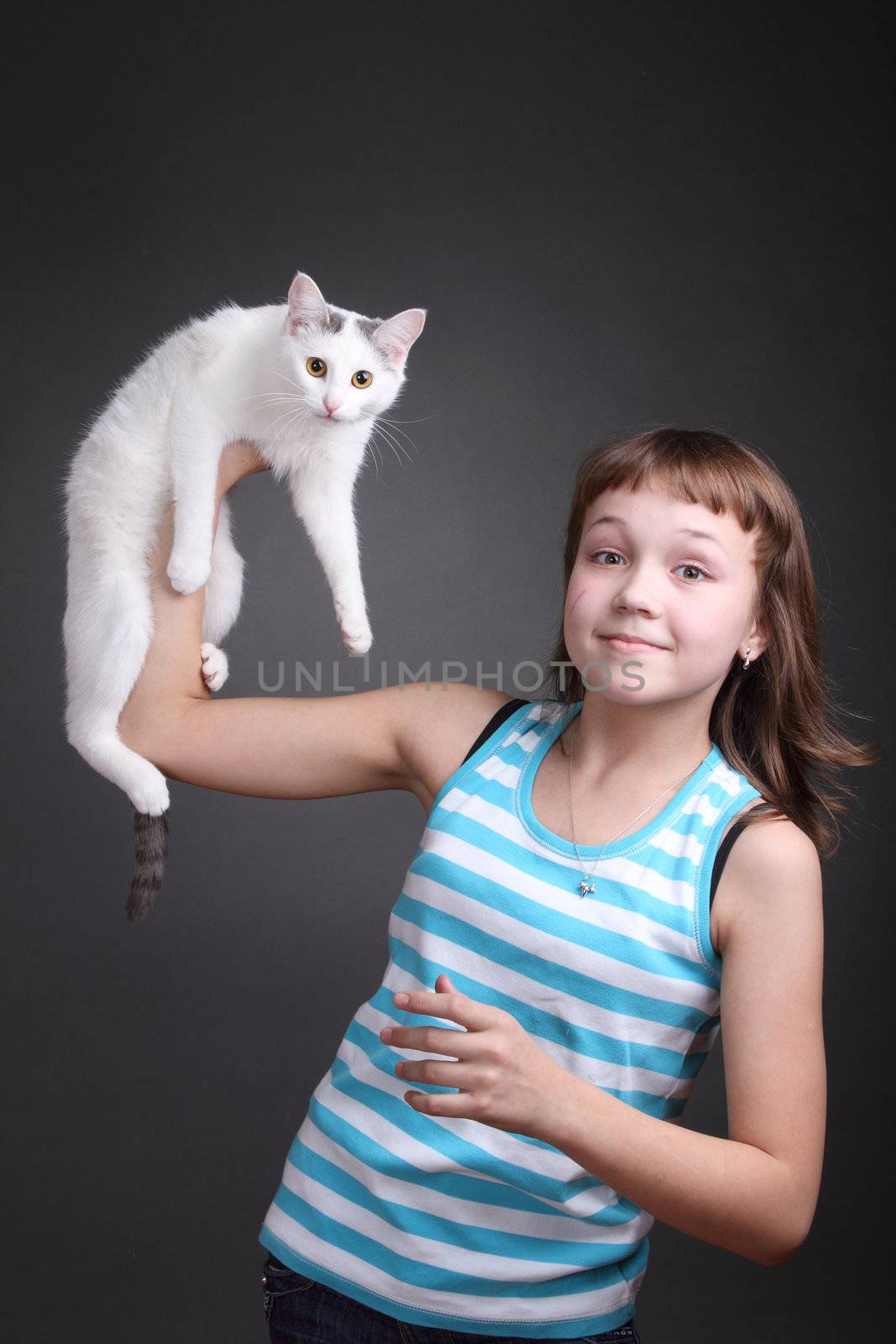 the girl and white cat play. close up. double 9