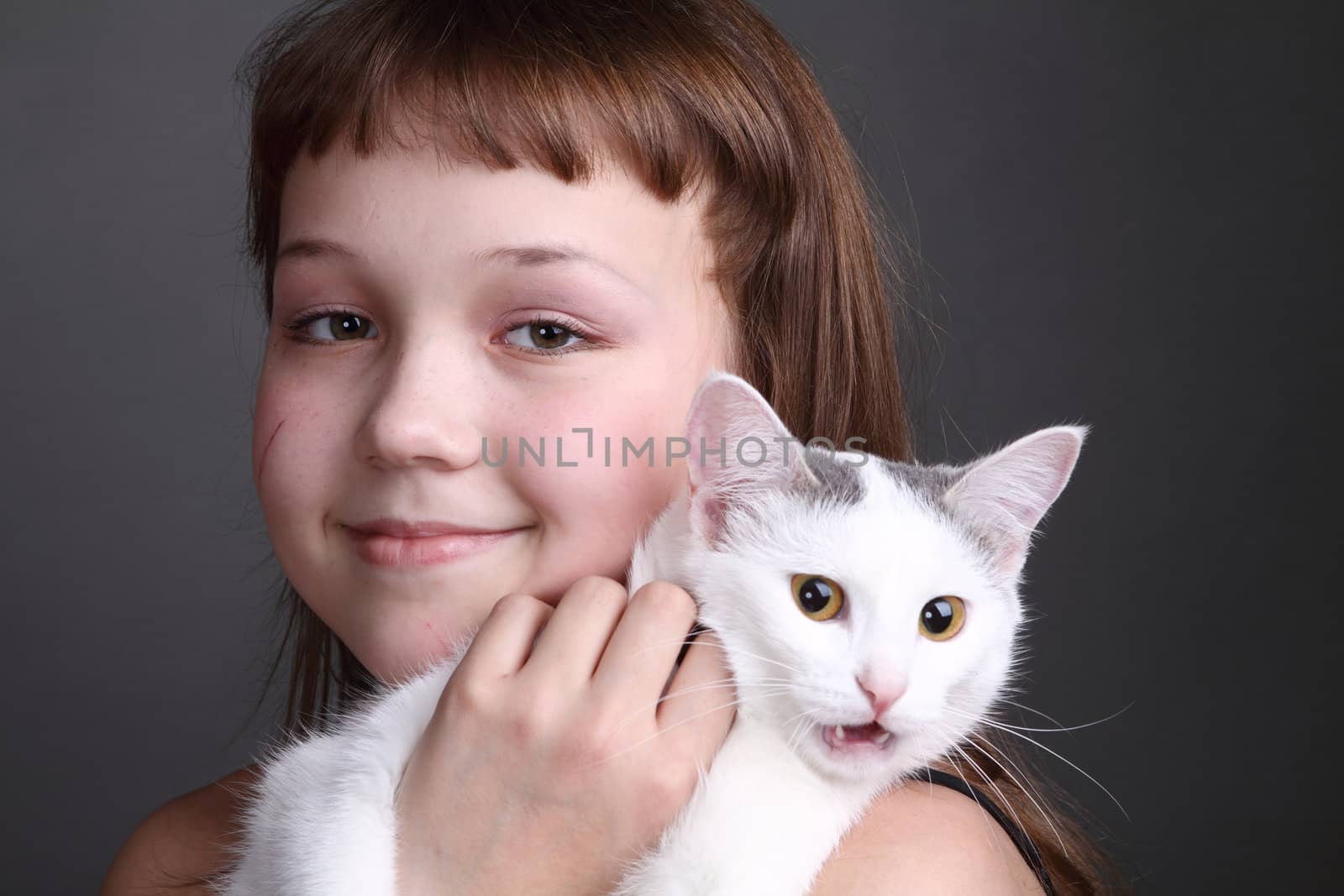 the girl and white cat play. close up. double 8