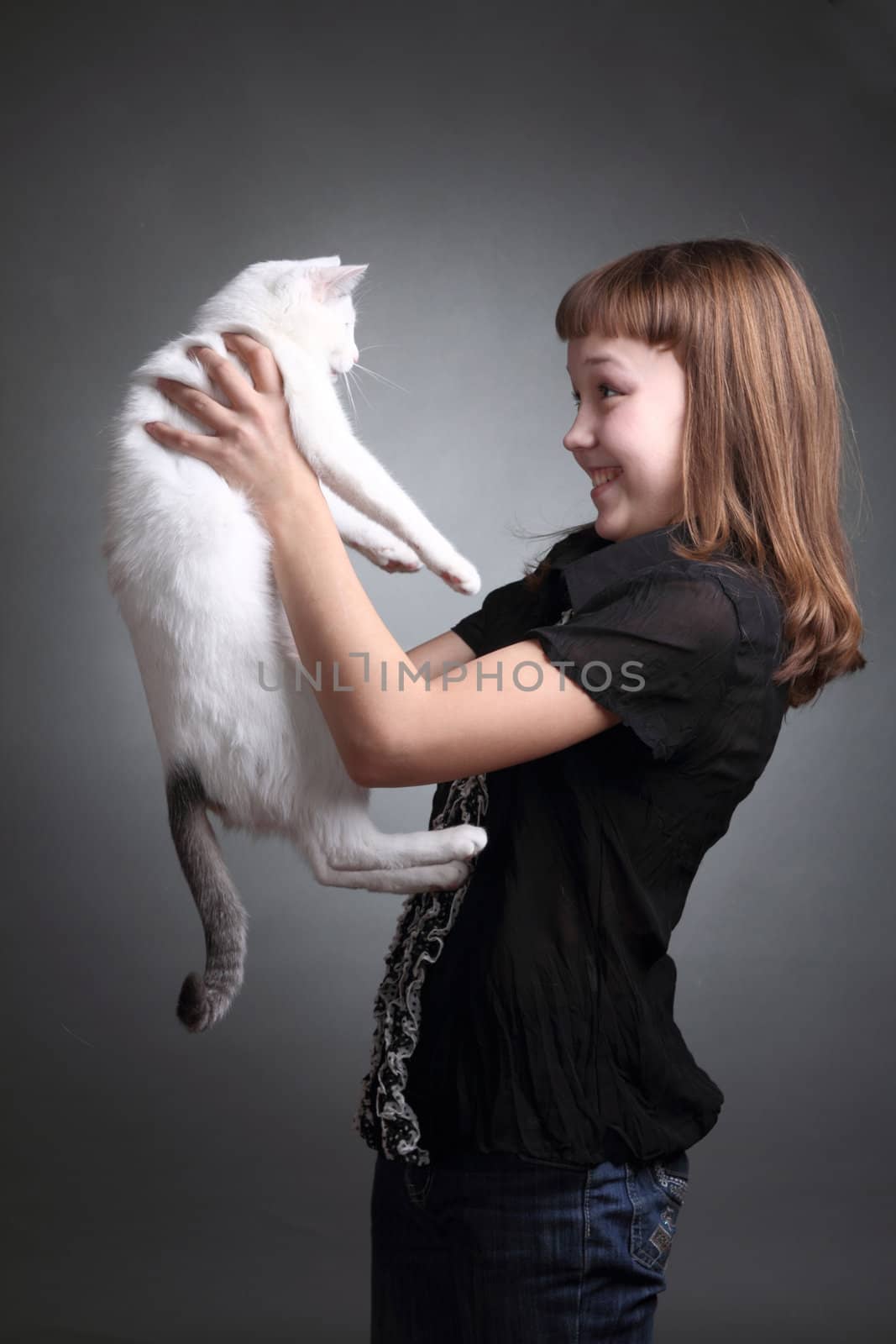 the girl and white cat play. close up. double 4
