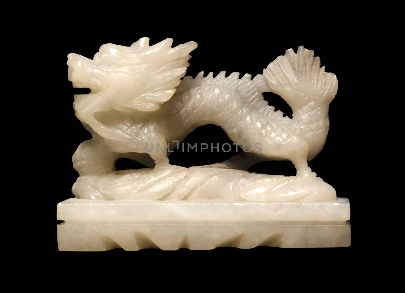 small white soapstone figure showing a chinese dragon in black back