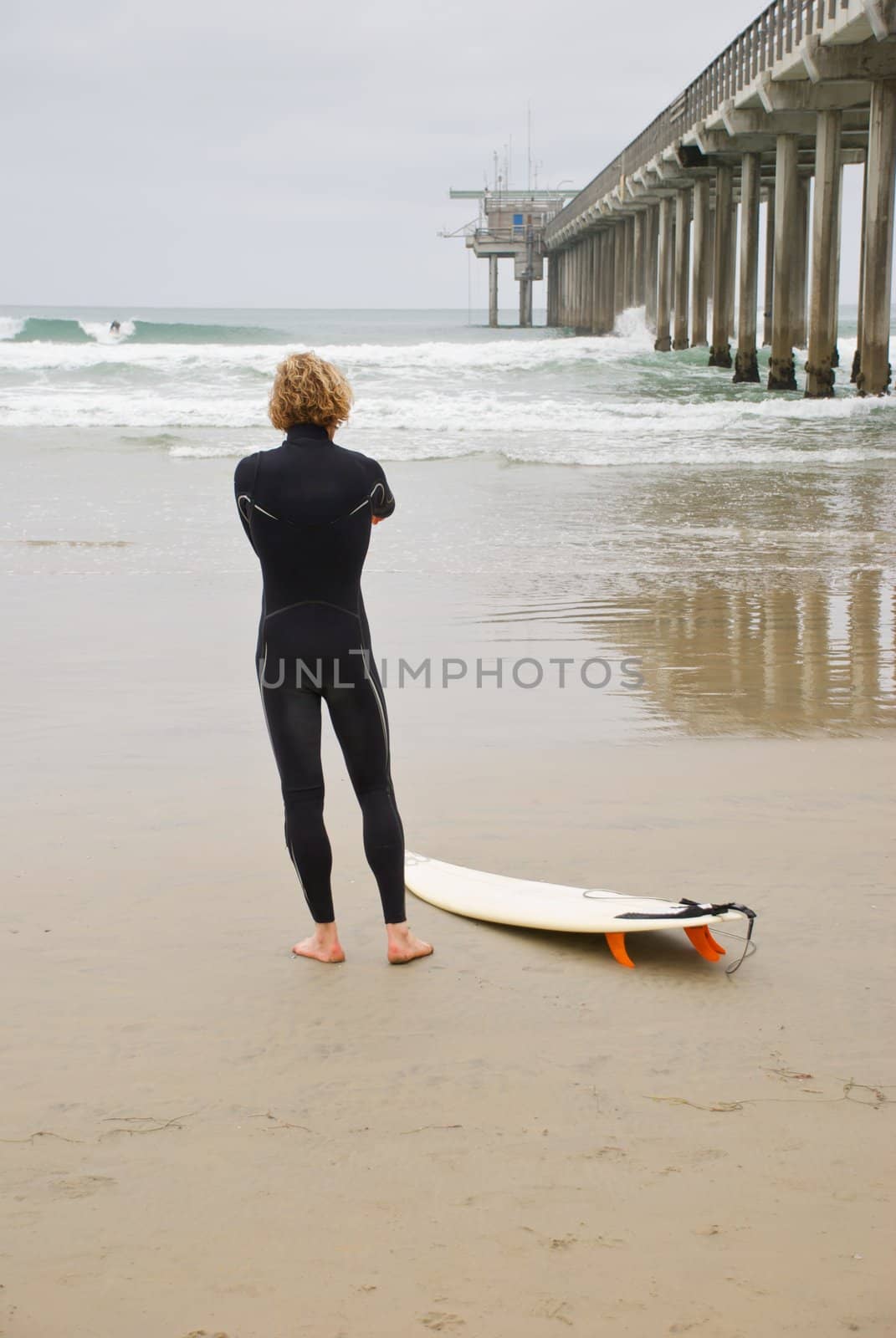 Surfer Sizing Up The Waves by pixelsnap