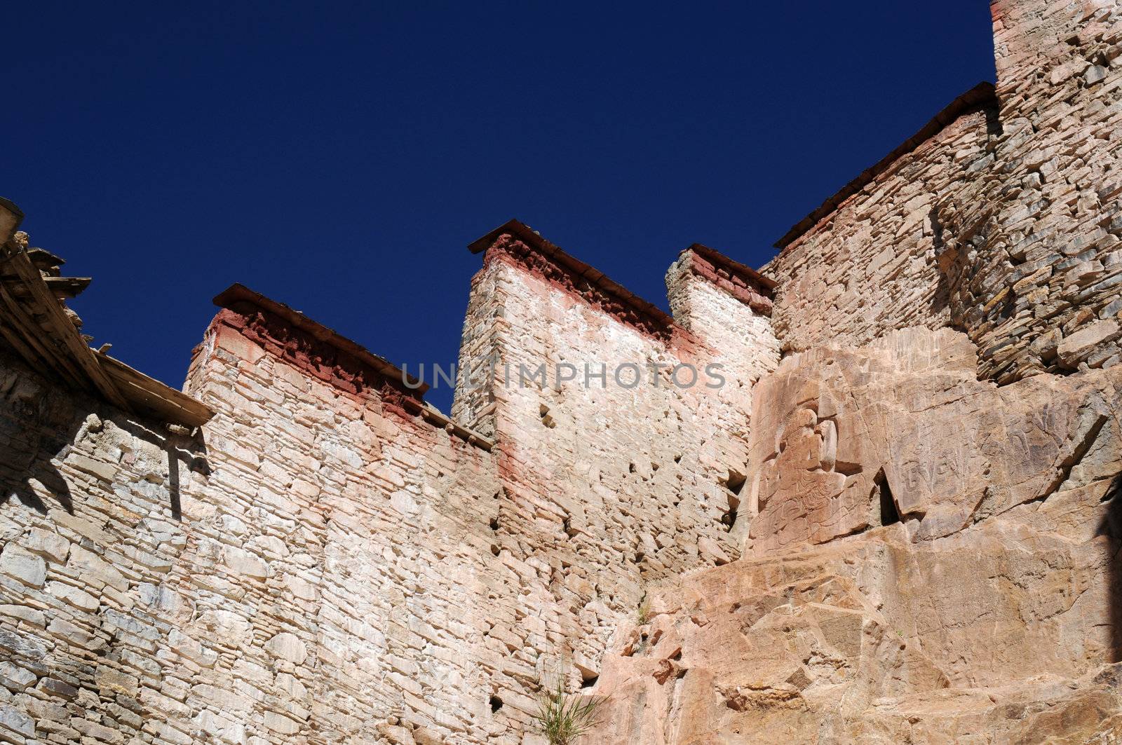 Landmark of typical historic Tibetan buildings against blue sky