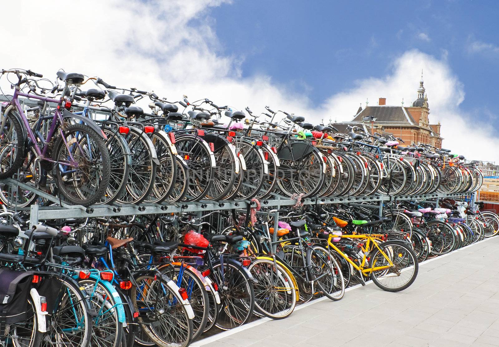 Plenty bicycles at parking lot in 