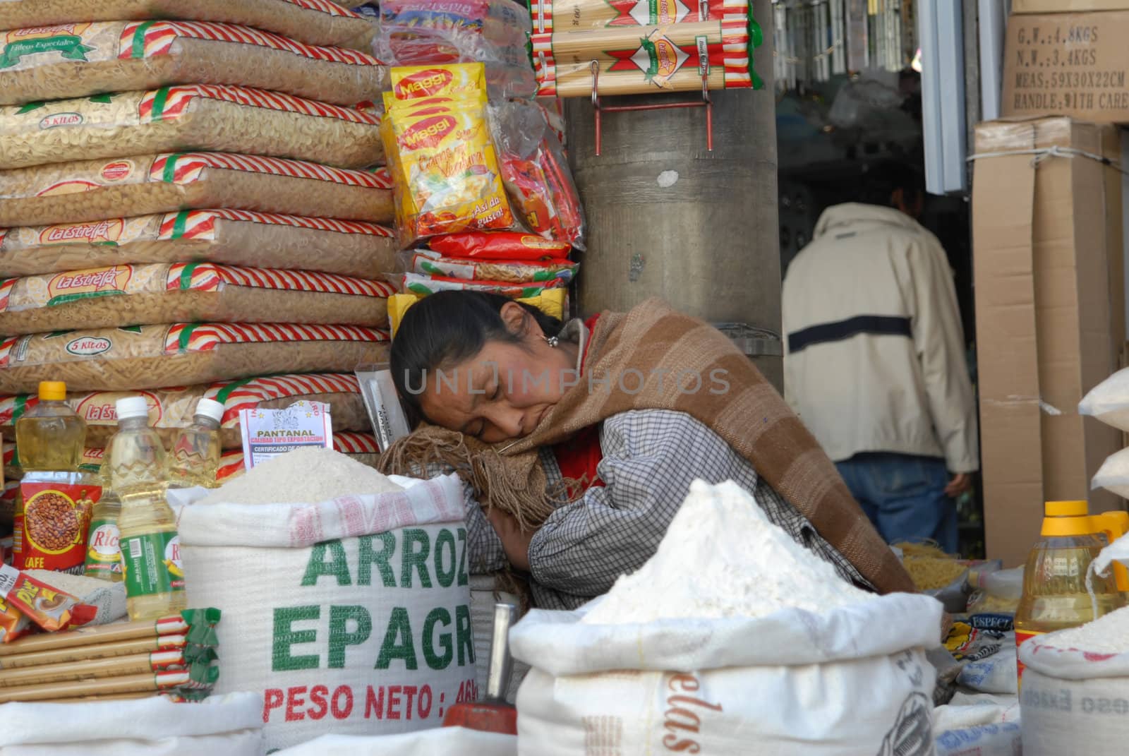 La Paz, Bolivia June 23, 2006. A woman walking the path of rice Paz. In the streets of the capital markets can be found feeding