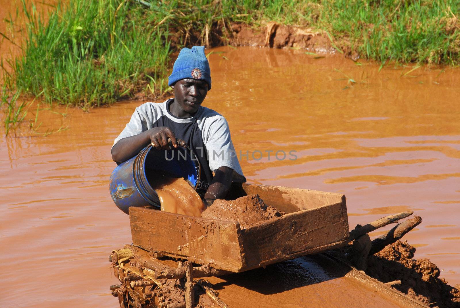 Shinyanga, Tanzania March 18, 2010:Young gold miner search. Tanzania is the third gold producer in Africa after Ghana and South Africa.